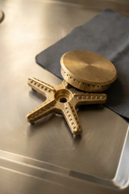Close view of a Thermador Star burner with the cap removed