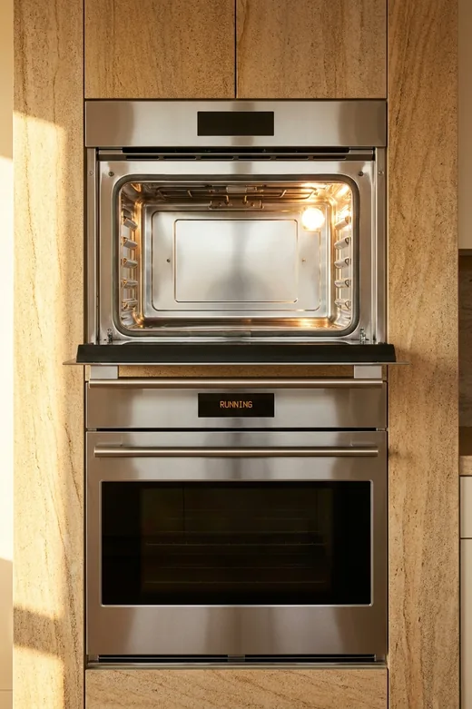 GE Monogram wall ovens, upper door open and lit